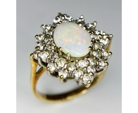 A FABULOUS OPAL AND DIAMOND CLUSTER RING SET IN PLATINUM  AND WITH A 9K GOLD SHANK .   4.2gms   size N 