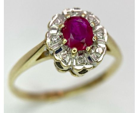 A 9K GOLD DIAMOND AND RUBY CLUSTER RING .   1.8gms    size M 