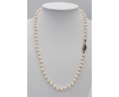 A Vintage Pearl Necklace with Gold and Sapphire Clasp. 43cm