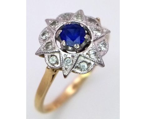 A VINTAGE 18K DIAMOND AND SAPPHIRE DRESS RING IN STAR SHAPE . 3.9gms size R