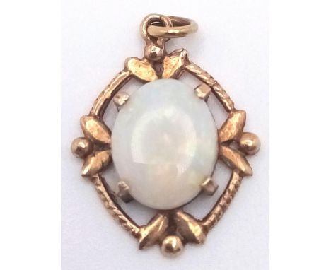 A FINE AUSTALIAN OPAL PENDANT SET IN 9K GOLD . 1.2gms