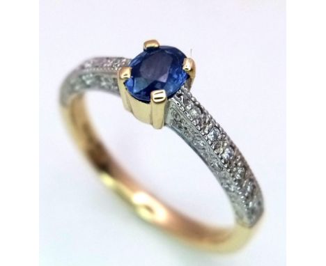 A 9K GOLD RING WITH CORNFLOWER BLUE OVAL SAPPHIRE AND DIAMOND SHOULDERS .   2.6gms   size N 