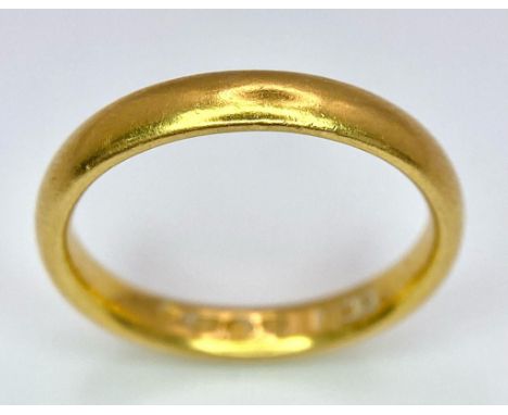 A 22K GOLD BAND RING . 4.2gms size L