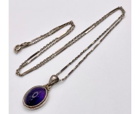 A vintage 925 silver Purple stone pendant on silver chain. Total weight 8.15G. Total length 58cm. 