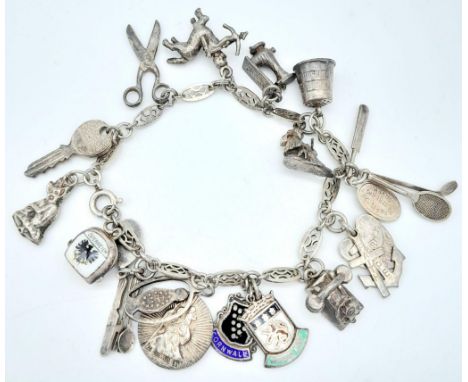 A vintage sterling silver multiple charm bracelet. Total weight 34.7G. Please see photos for details. 