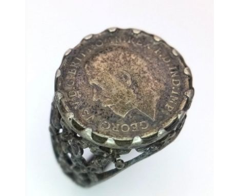 A vintage sterling silver Georgian coin ring with floral design on shoulder. Total weight 4.8G. Size O. 