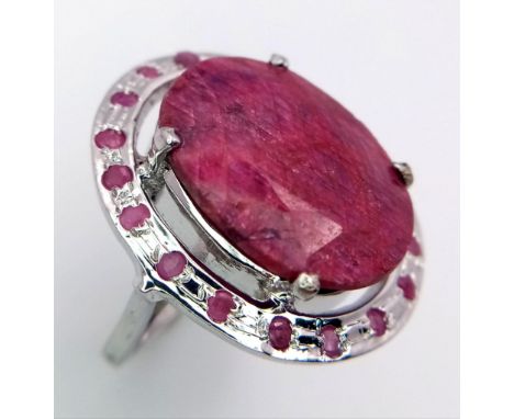 An Oval Shaped Ruby Gemstone 925 Silver Ring - with Ruby Gemstone Accents.  Weight - 13.30g. 42ct Madagascan Ruby.Size P. Com