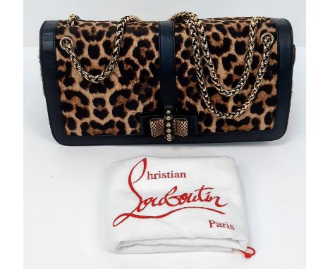A Christian Louboutin Sweet Charity Leather and Leopard Print Pony Hair Shoulder Bag. Gold tone hardware and shoulder strap. 