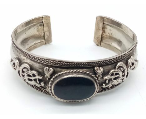 A Vintage or Older, Silver Oriental Dragon Detailed Black Onyx Cabochon Cuff Bracelet. 6.5cm Inner Width. 22.23 Grams 