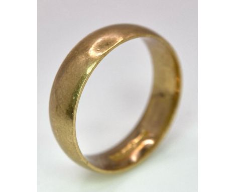 A Vintage 9K Yellow Gold Band Ring. 6mm width. Size T. 5.05g weight. Full UK hallmarks. 