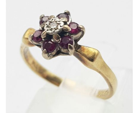 A 18K YELLOW GOLD DIAMOND &amp; RUBY RING. TOTAL WEIGHT 3.2G. SIZE K 