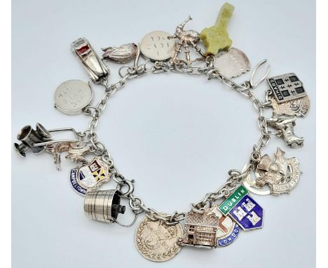 A vintage sterling silver multiple charm bracelet. Total weight 36.3G. Please see photos for more details. 