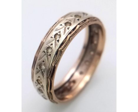 A Vintage 9K Yellow and White Gold Diamond Eternity Ring. Size O 1/2. 3.15g weight.