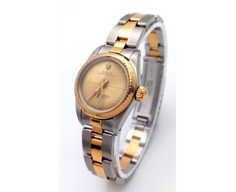 A ROLEX LADIES BI-METAL AUTOMATIC WATCH WITH GOLDTONE DIAL , LATEST STYLE STRAP AND ORIGINAL ROLEX GUARANTEE.  24mm 