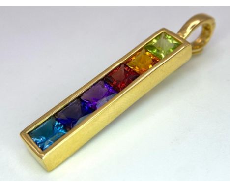 An 18K Yellow Gold Multi-Gemstone Bar Brooch. Peridot, Citrine, Ruby, amethyst, sapphire and topaz! 4cm. 6.5g total weight. 