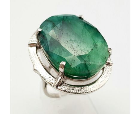 An Oval Shaped Brazilian Emerald 925 Silver Ring. Size P. Weight - 18.80g. Comes in a presentation case. Ref: VO-1913. 