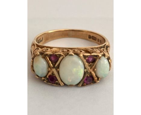 Vintage 9 carat YELLOW GOLD,OPAL and RUBY RING. Full UK hallmark. Complete with jewellers vintage ring box. 3.4 grams. Size J