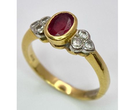 An 18K Yellow Gold Ruby and Diamond Ring. Central oval ruby with six round cut diamond accents. Size M. 3.75g total weight. R