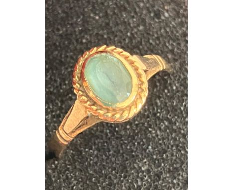 9 carat GOLD RING with Oval Cut BLUE TOPAZ set to top. Attractive GOLD ROPE Surround. Full UK hallmark. Complete with ring bo