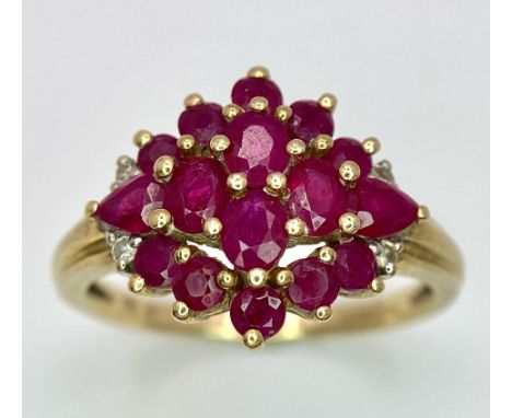 A 9K GOLD PINK RUBY CLUSTER RING . 3.3gms size R