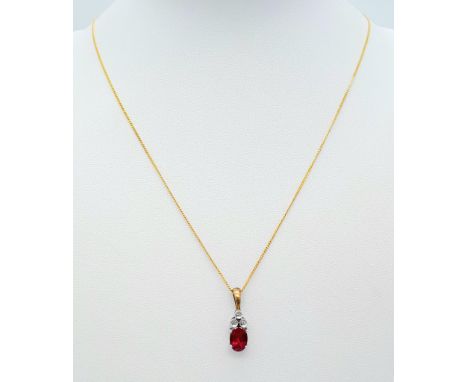 A 9K YELLOW GOLD DIAMOND & RED STONE PENDANT BELIEVED TO BE RUBY & 9K GOLD CHAIN 2.8G , 46cm length.A/S 1027 