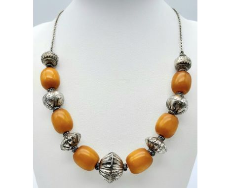 A vintage Baltic amber and beads necklace. Total length 50cm. Please see photos for more details 