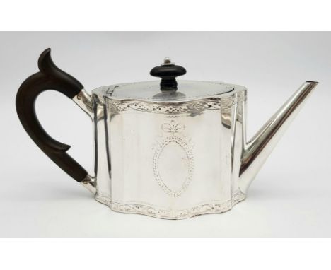 A 1785 Hester Bateman George III Silver Teapot. Oval form with empty cartouche to side. Minimalist geometric  decoration with