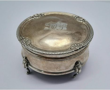 A Beautiful Antique Sterling Silver Trinket Circular Case. Monogram hinged lid, pedestal feet. 6cm diameter. 41.5g weight.