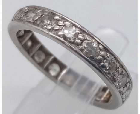 A PLATINUM AND DIAMOND FULL ETERNITY RING .   3.9gms   size M 