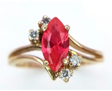 A 14K GOLD RUBY AND DIAMONDS DESIGNER RING .   3.1gms   size M 
