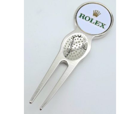 A Rolex Branded Golf Putting Repair Divot Tool. Pop out ball marker. As new. 8cm.