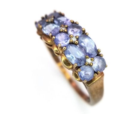 A Vintage 9K Rose Gold Amethyst Ring. Oval and circle cut amethysts over two rows. Size Q 1/2. 2.75g weight.