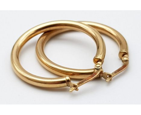 A Pair of Vintage 9K Yellow Gold Hoop Earrings. 25mm diameter. 2.36g total weight. 