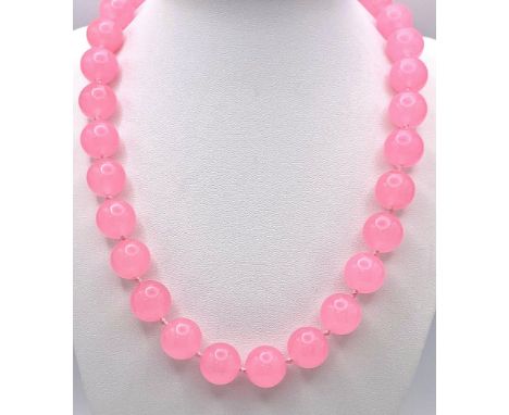 A Bright Pink Jade Bead Necklace. 14mm beads of sunshine!44cm necklace length. 