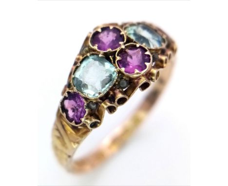 An Antique George IV, 12K Gold, Ruby and Aquamarine Ring. Four bright pink rubies and two ice blue aquamarines create a piece