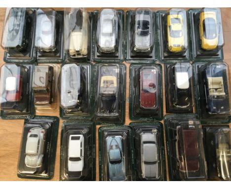 A collection of carded 1:43 scale Atlas diecast vehicles