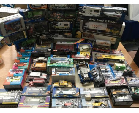 A collection of boxed diecast vehicles including corgi, Maisto etc