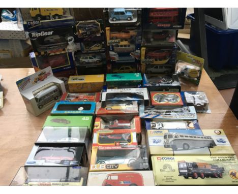 A collection of boxed diecast vehicles including corgi, Burago, Rio, etc