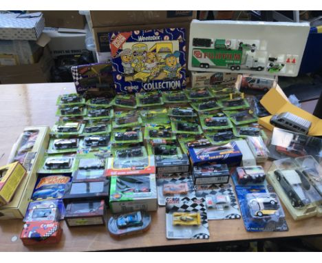 A collection of boxed diecast vehicles including Corgi