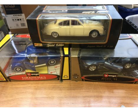 Maisto and Burago 1:18 scale boxed diecast vehicles including Volkswagen Beetle , BMW and Jaguar MK 2