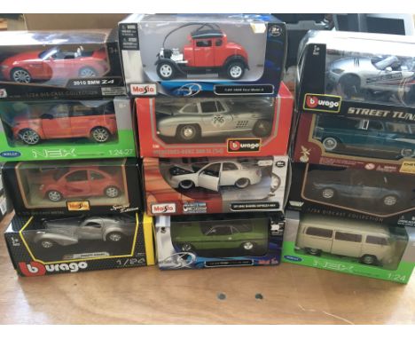 A collection of boxed 1:24 scale diecast vehicles including Fords , BMWs, Subaru etc