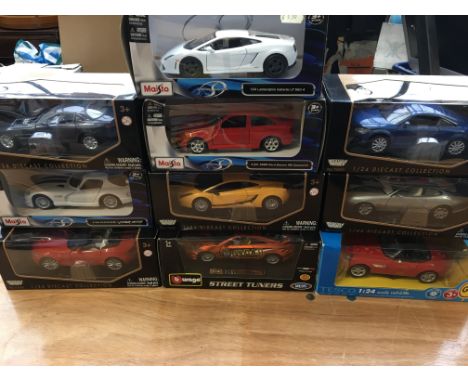 Maisto and Burago 1:24 scale boxed diecast vehicles including a Dodge Viper, Ford Escort cosworth, Lamborghini etc x10