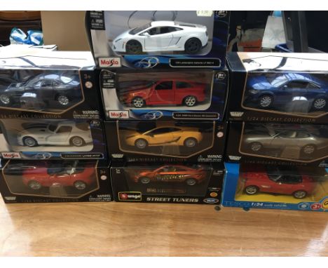 Maisto and Burago 1:24 scale boxed diecast vehicles including a Dodge Viper, Ford Escort cosworth, Lamborghini etc x10