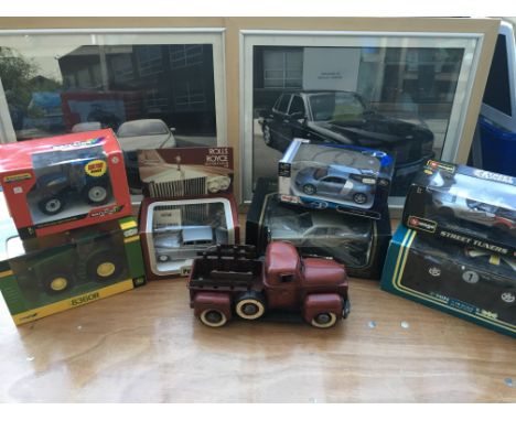 A collection of boxed diecast vehicles including 1:18 , 1:24 scale including Britain’s Tractors, Maisto, Burago Mini Cooper a