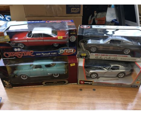 Collection of boxed diecast 1:18 scale vehicles including Plymouth fury from Christine , 1967 Shelby, Dodge Viper and a Stude