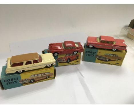 Corgi toys boxed diecast including Chevrolet Impala 220, Aston Martin DB5 218 and a Plymouth sports suburban station wagon