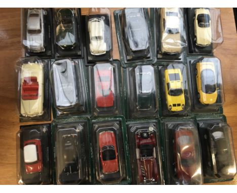 A collection of carded 1:43 scale Atlas diecast vehicles x18