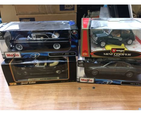 Burago and Maisto boxed 1:18 scale diecast vehicles including a Mini Cooper, Jaguar s-type etc