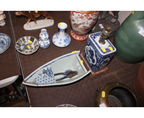 A Japanese figure in the boat jardiniere AF; a Chinese dragon decorated table lamp etc. 