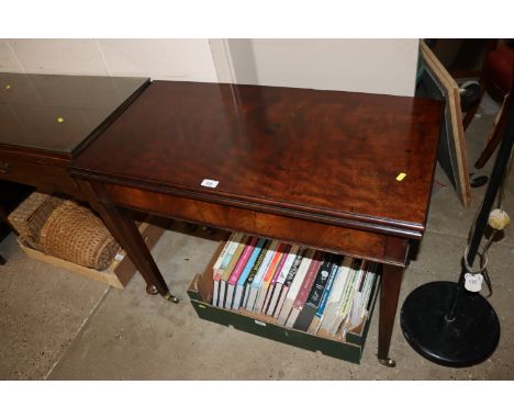 A 19th Century mahogany card table fitted single drawer to frieze, raised on square tapering supports terminating on brass ca